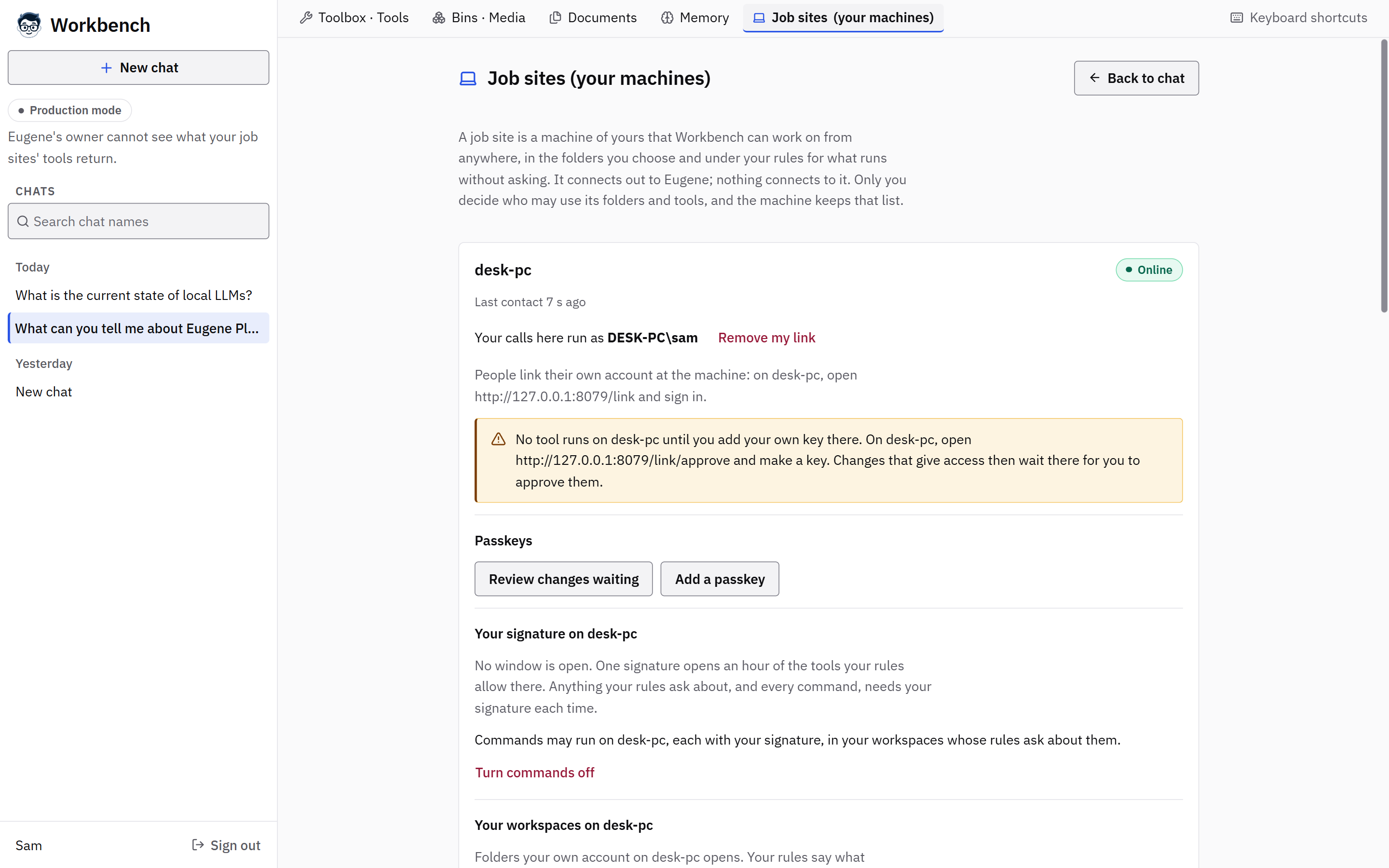 Workbench's Job sites page for one person: the machine desk-pc is online, their calls run as their own account there, a note says no tool runs until they add their own key at the machine, and sections follow for passkeys, their signature window and their workspaces.